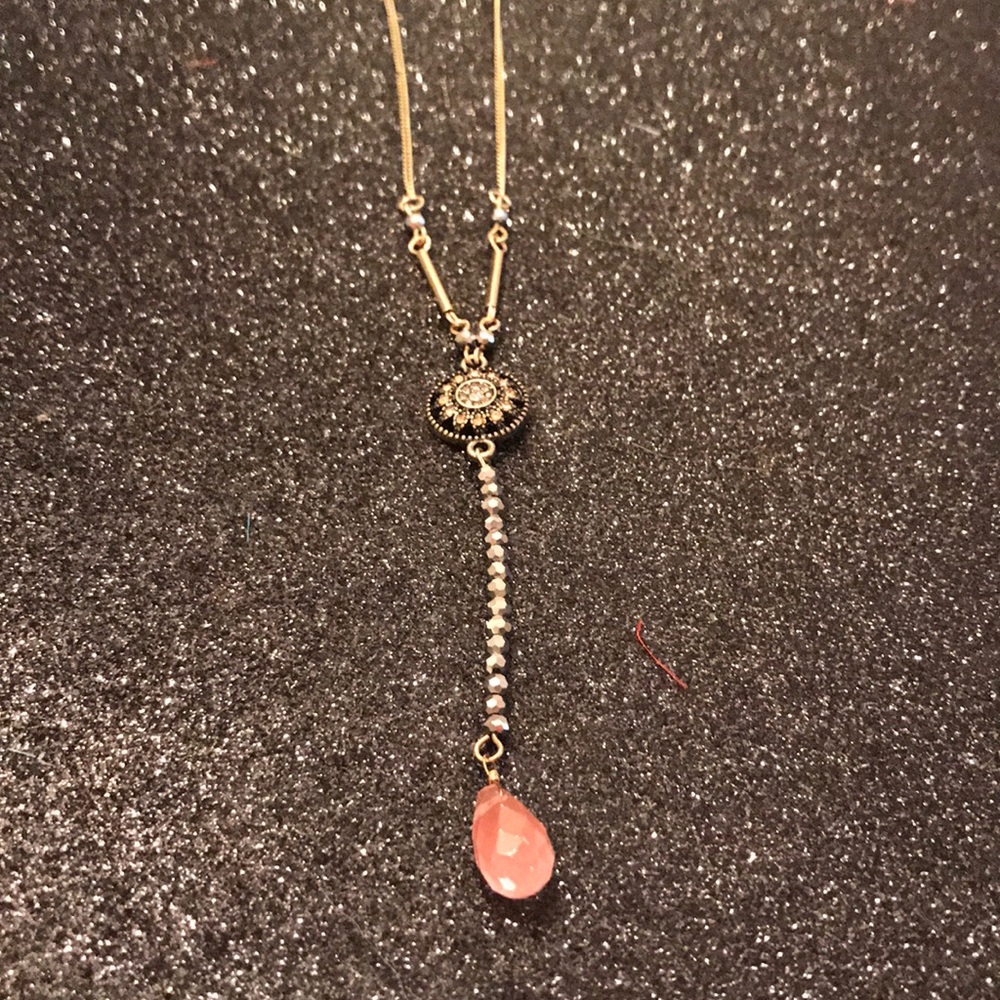 Long gold bead necklace